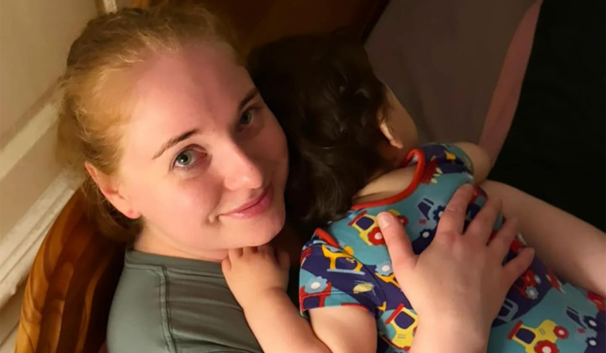 Woman hugging her son at night