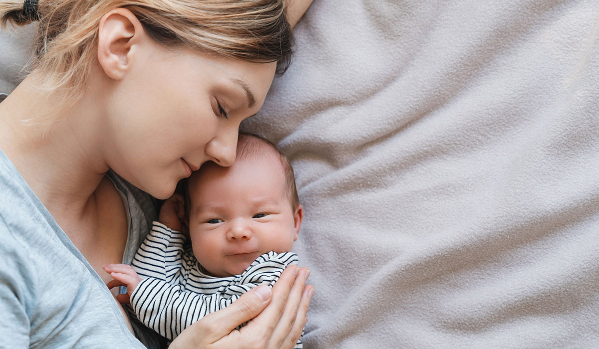 Mother and baby. Loving mom spending time with her little 2 weeks old child at home. Image of bonding mother and baby, healthy physical and mental development of child, happy maternity and family.; Shutterstock ID 2402664105; purchase_order: -; job: -; client: -; other: