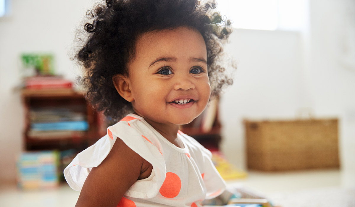 Happy Baby Girl Playing With Toys In Playroom; Shutterstock ID 710812894; purchase_order: -; job: -; client: -; other:
