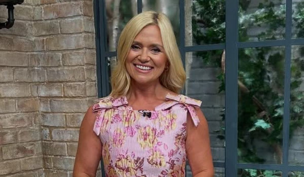 Karen Koster in a pink dress