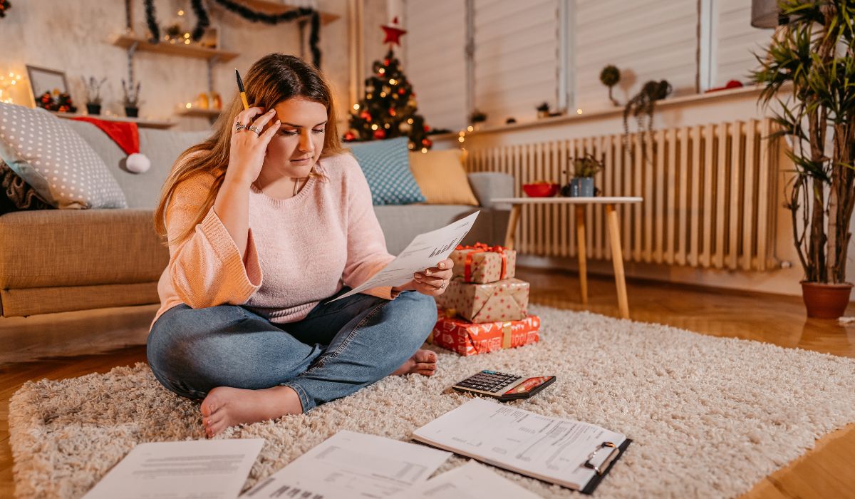 Woman looking at finances at Christmas