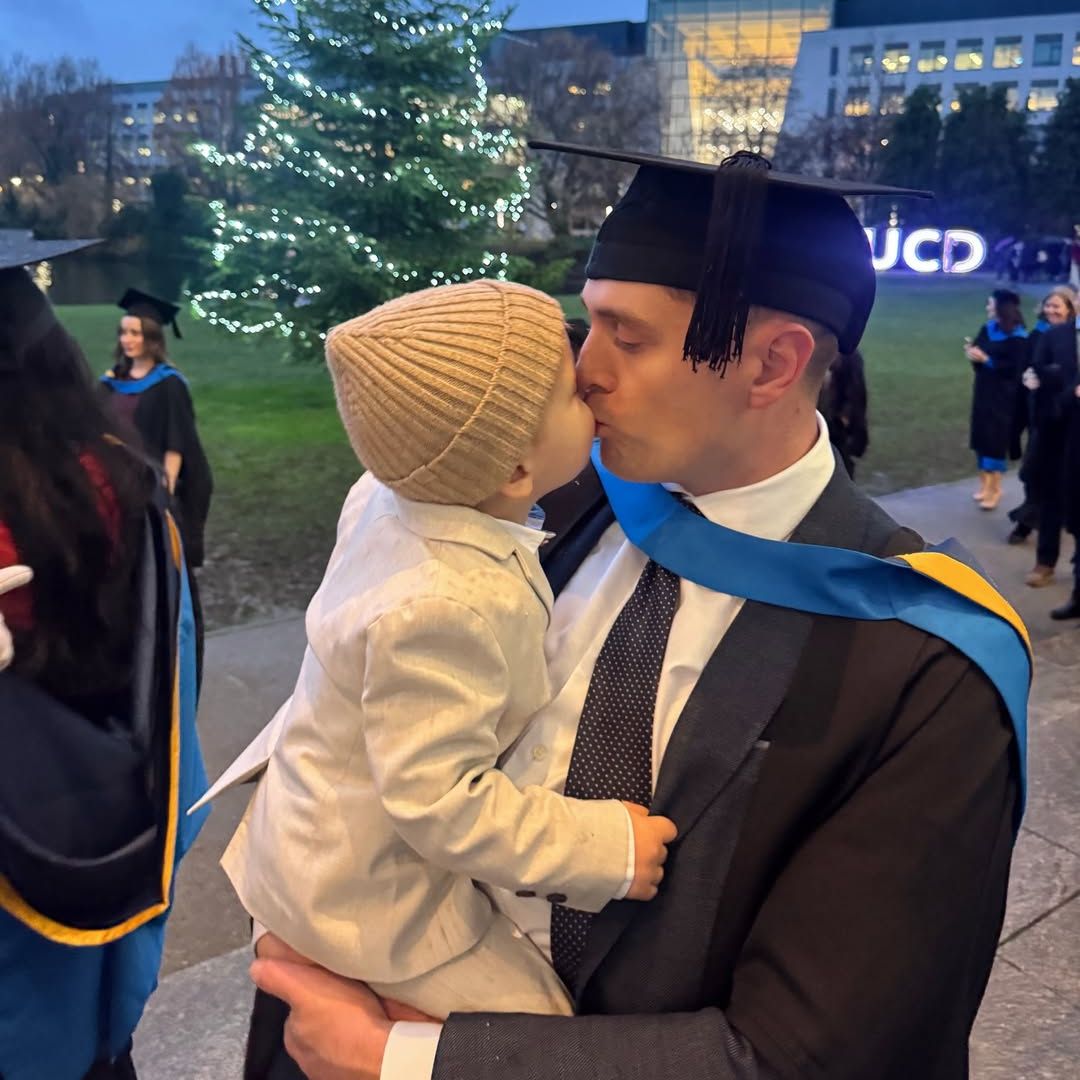 Louise Cooney's husband and son at graduation