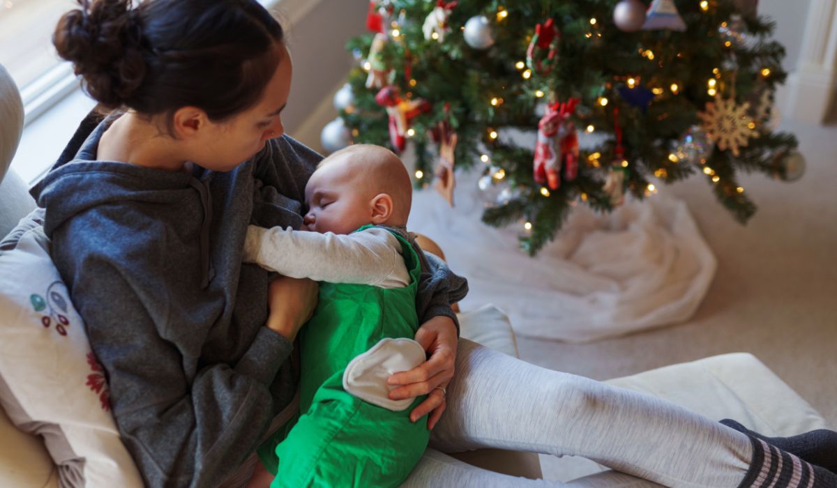 Mother breastfeeding at Christmas