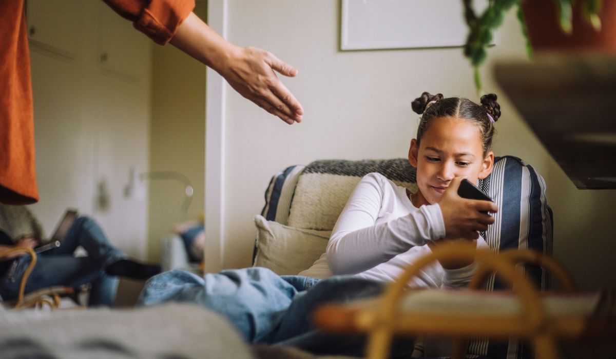 Young girl holding phone