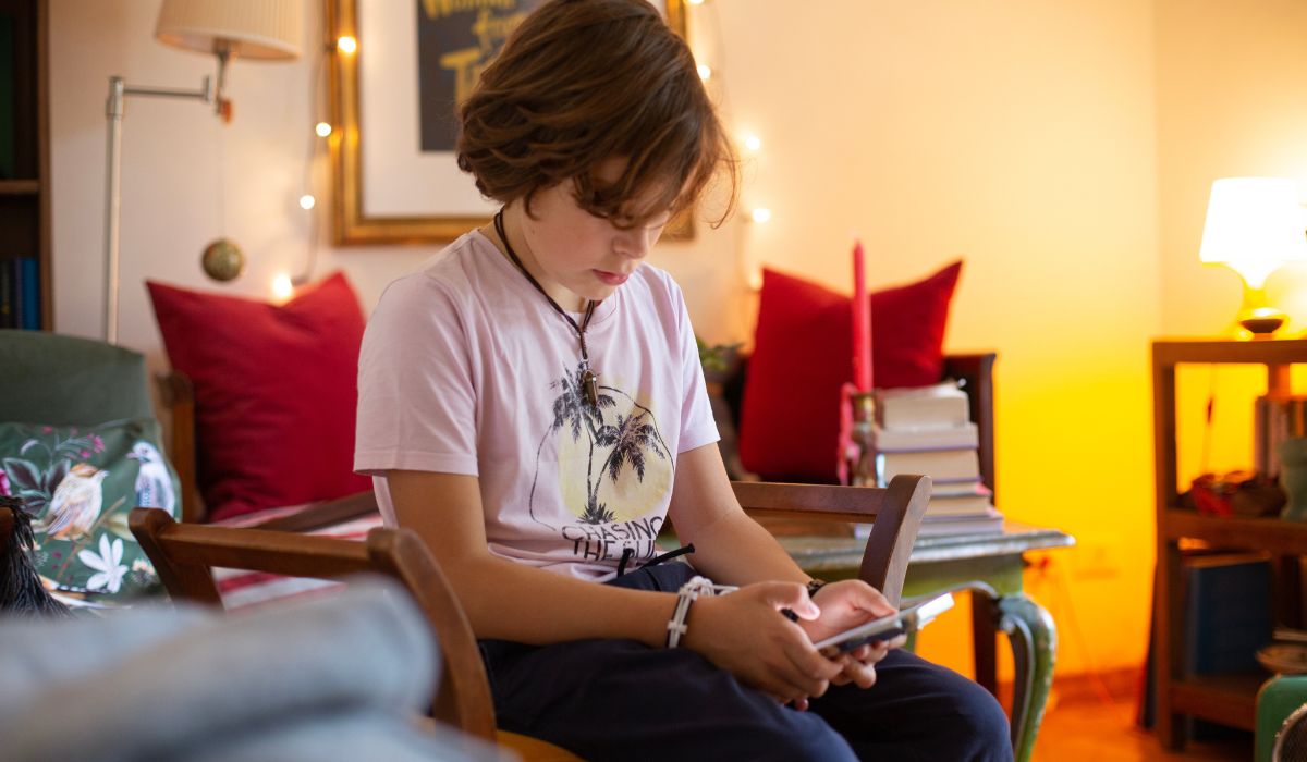 Tween boy using phone