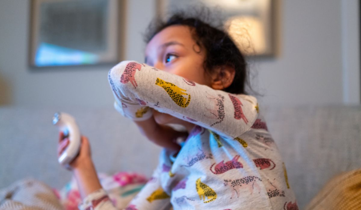 Young girl coughing