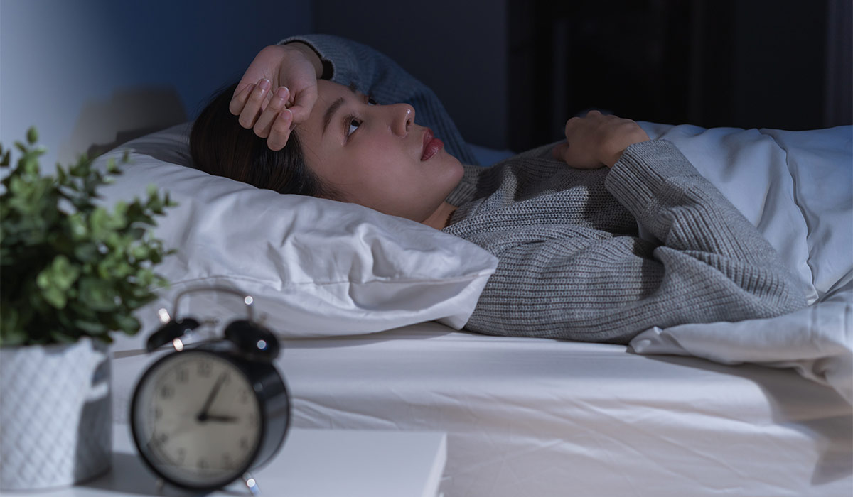 Annoyed, stressed, anxiety asian young woman suffering from insomnia, frustrated awake on bed at night, headache or migraine, health care problem, disturbed trouble of loud noise, unable sleepless.; Shutterstock ID 2629669601; purchase_order: -; job: -; client: -; other: