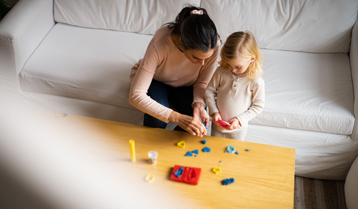 Nanny playing with little girl