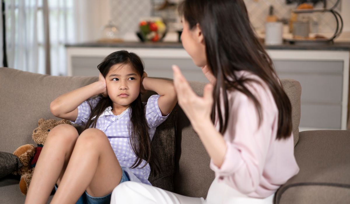 Mother disciplining daughter