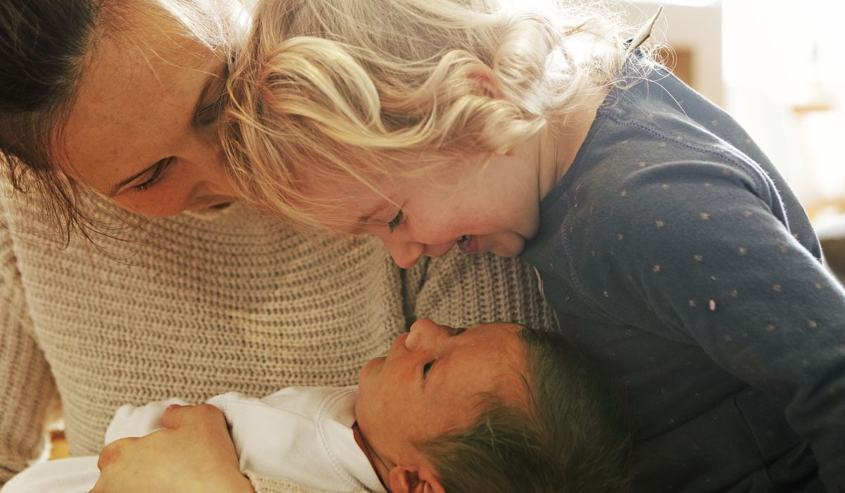 Mother with baby and toddler