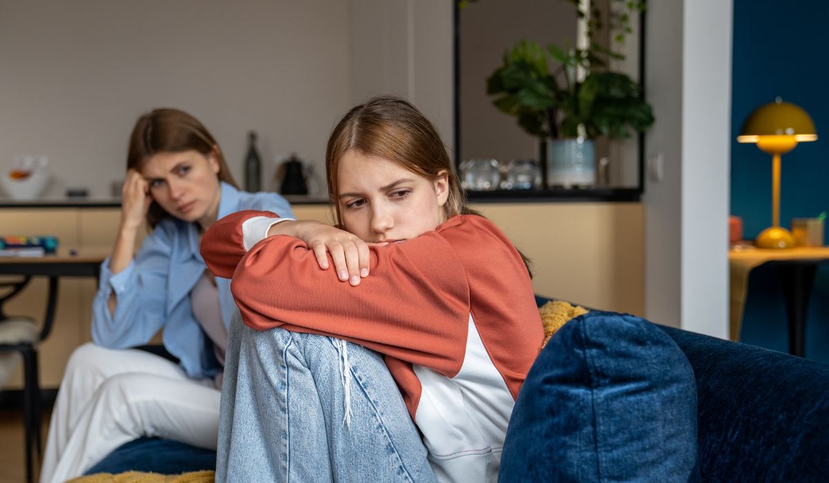 Teenage girl talking to mother
