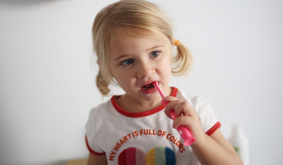 Girl brushing teeth