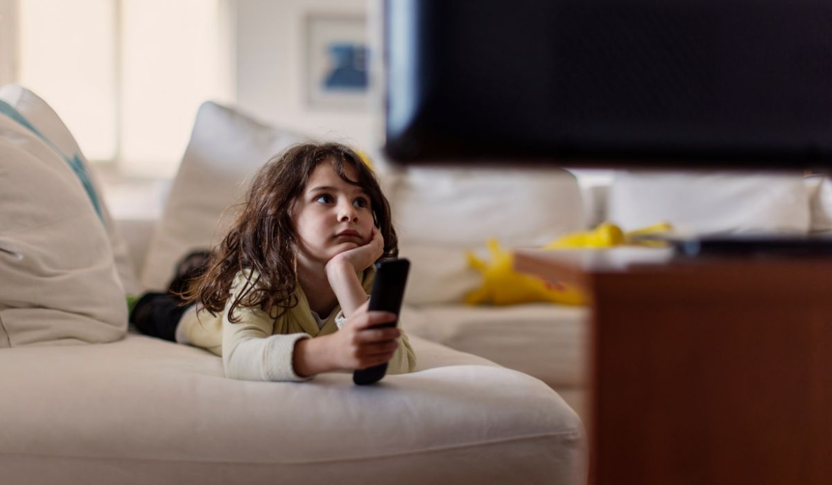 Child watching television subtitles