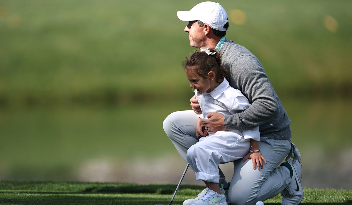 Rory McIlroy of Northern Ireland sits with his daughter Poppy during the Par Three Contest prior to the 2026 Masters Tournament at Augusta National Golf Club. Pic: Getty Images