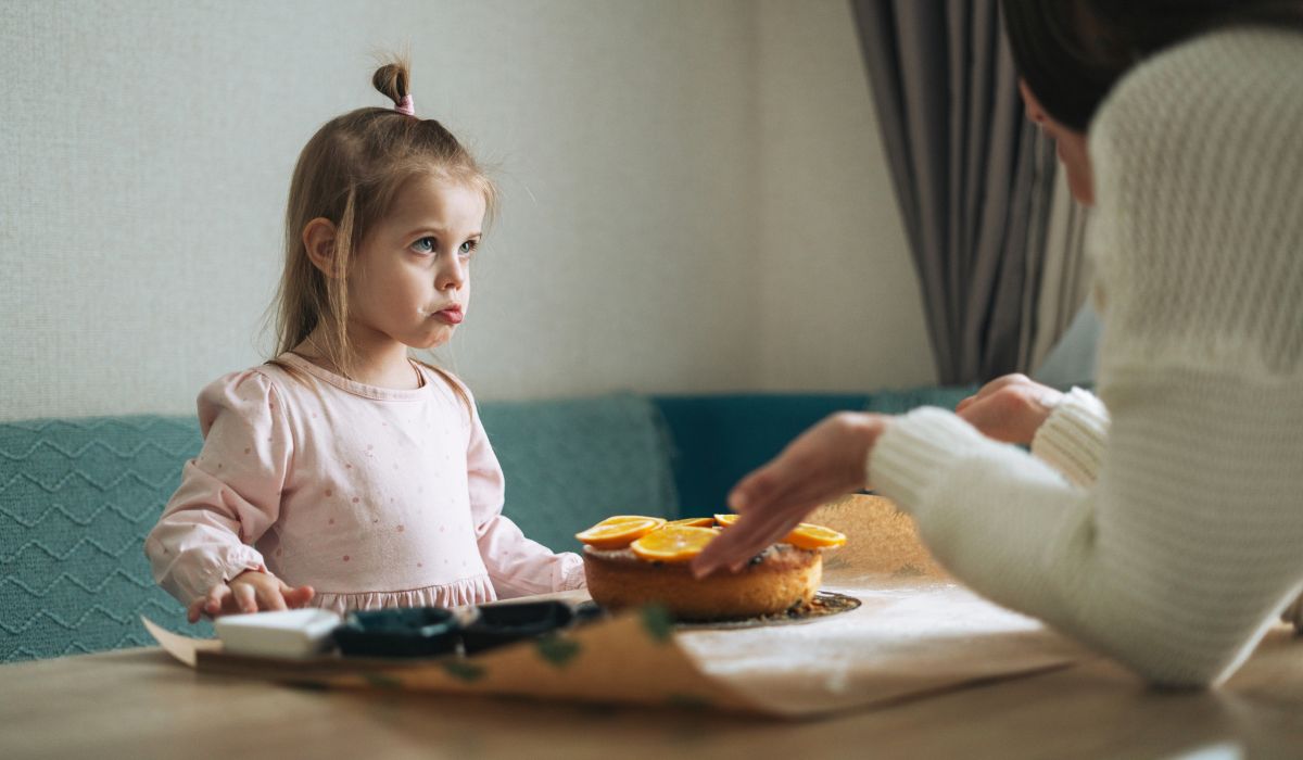 Mother scolding little girl