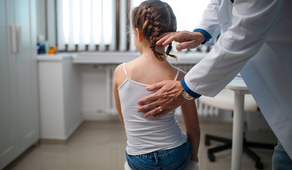 Little girl getting assessed by doctor