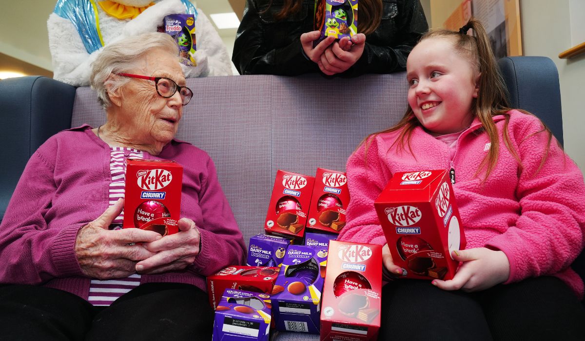 101-year-old Jean O'Toole, a patient at the community rehabilitation unit, receives an easter egg from Ellamay Metcalfe at Our Lady's Hospice & Care Services, Harold's Cross, Dublin.