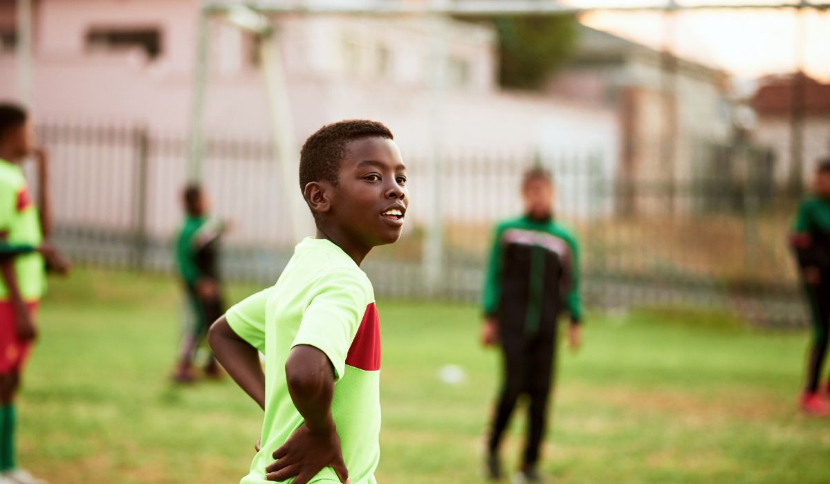 Child playing football