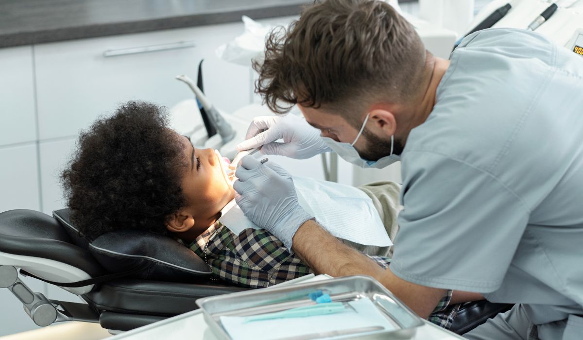 Dentist treating young patient