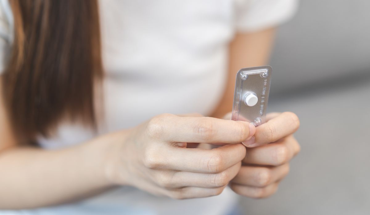 Woman taking morning after pill