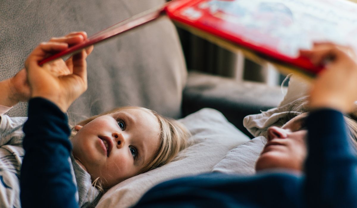 Parent reading book to child