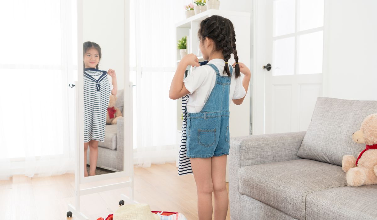 Little girl looking at clothes