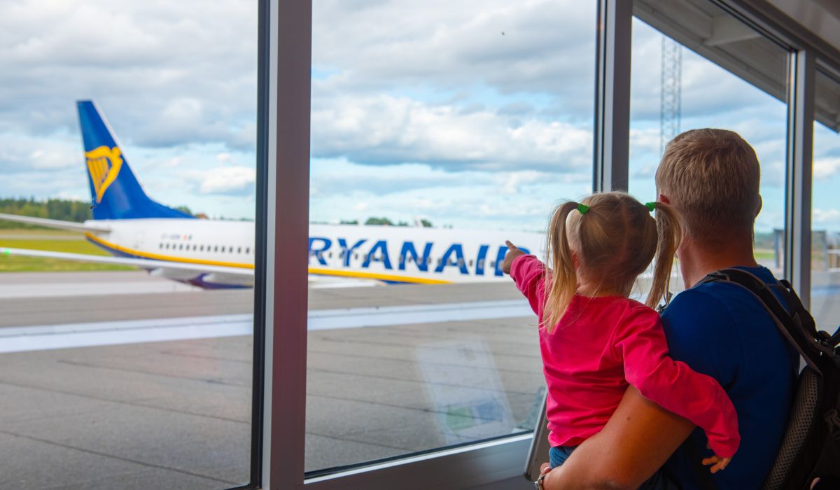 Girl pointing at plane