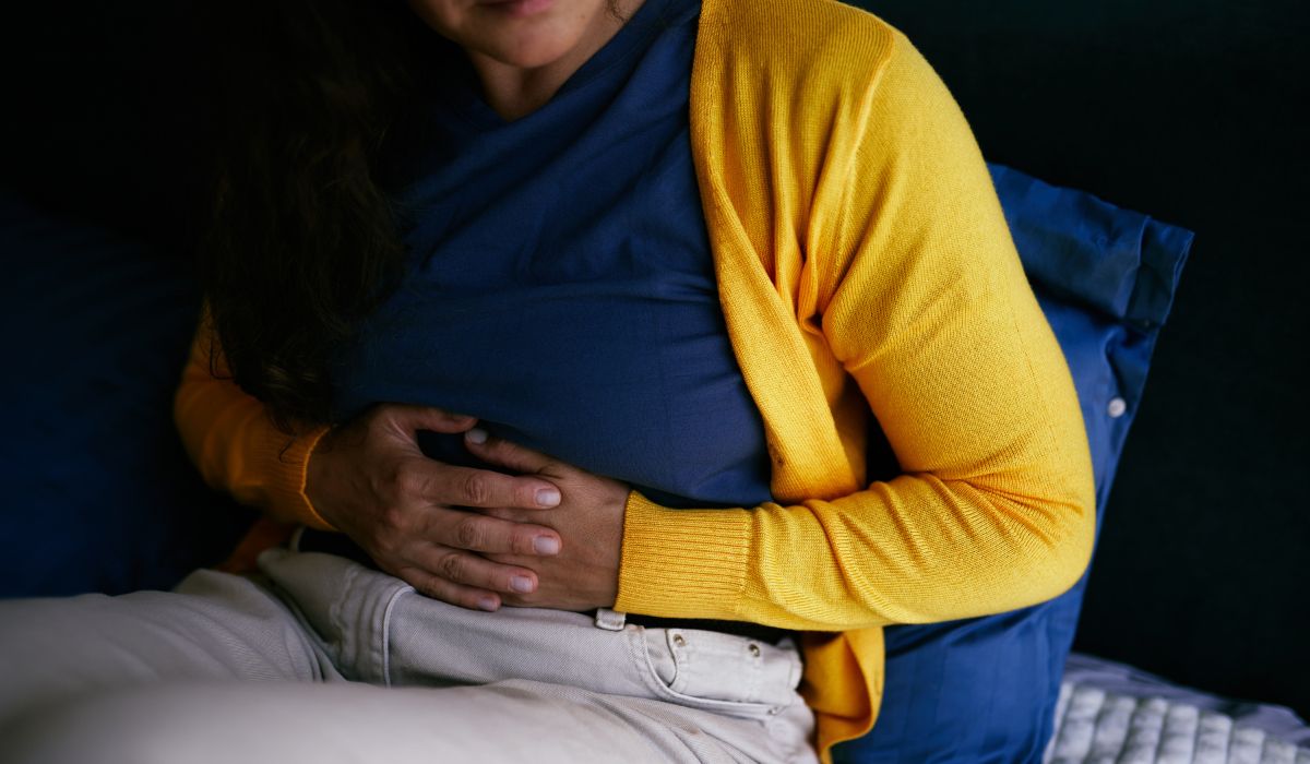 Woman holding stomach