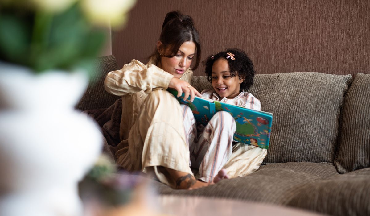Parent reading book to child