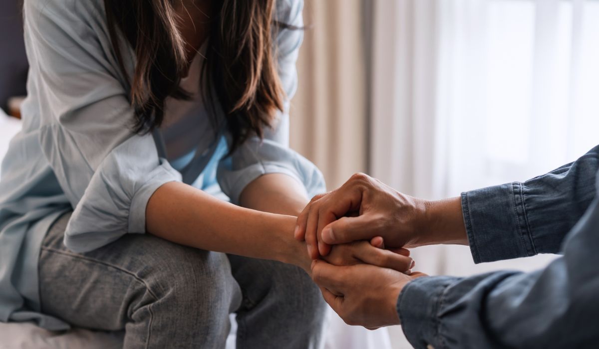 Couple holding hands