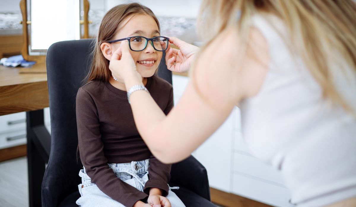 Girl getting glasses fitted