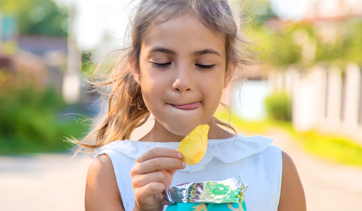 Girl eating crisps