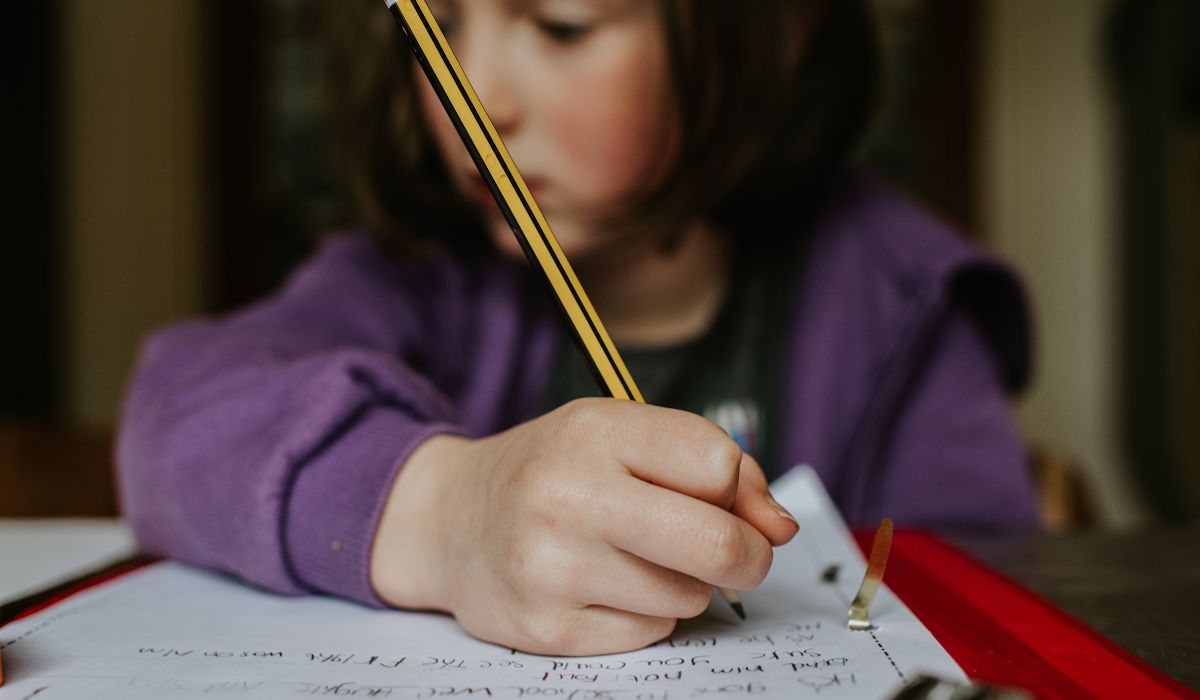 Girl writing in school