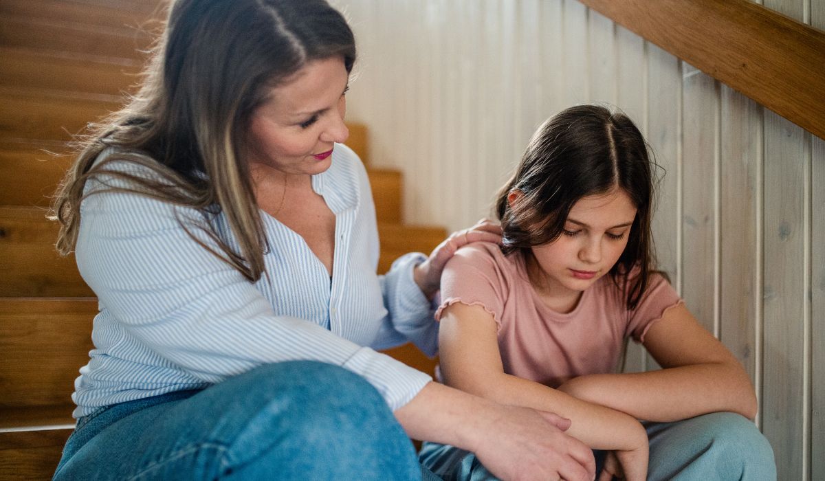 Mother talking to daughter