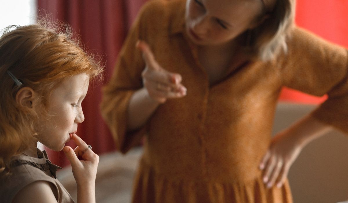 Mother scolding child