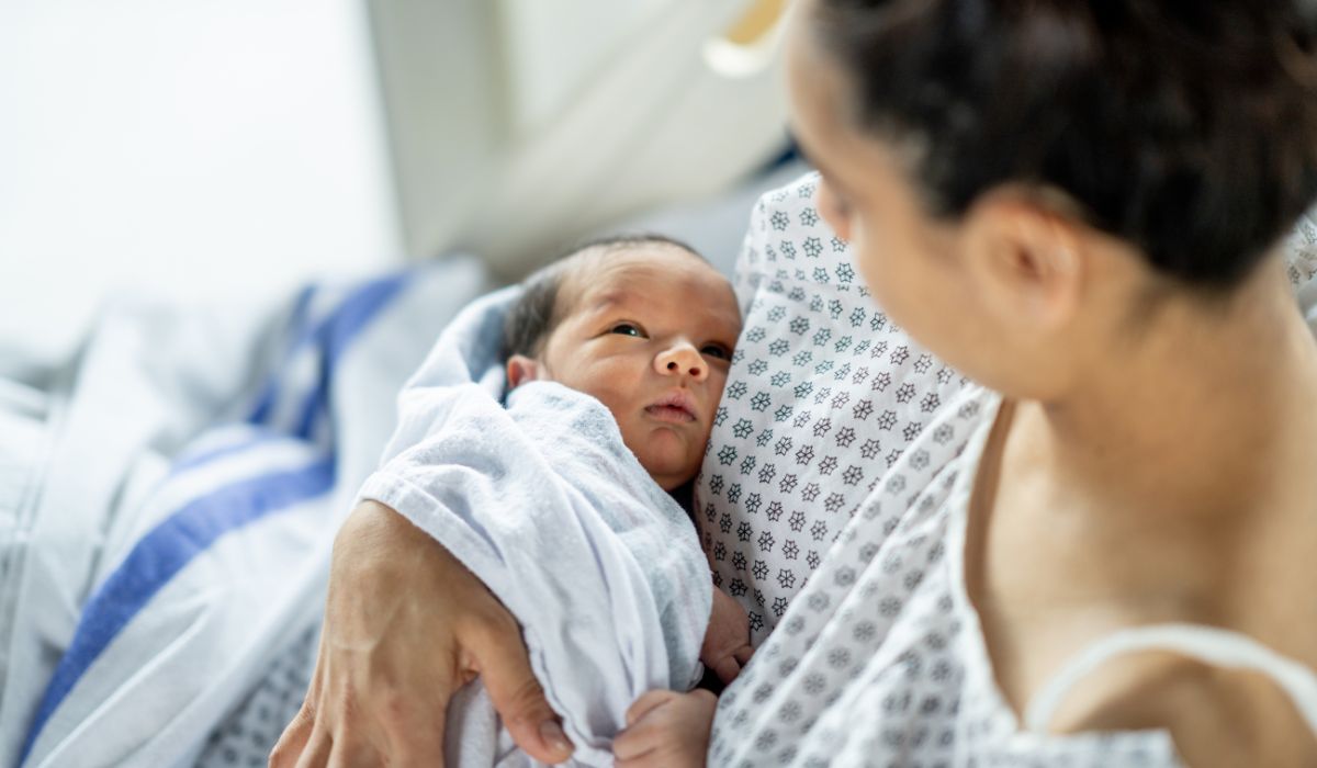 Mother holding newborn. Birth rates in Ireland decline
