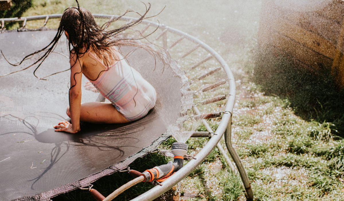 Child playing on trampoline
