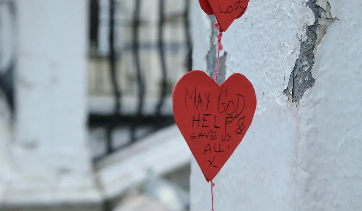 Flowers and tributes placed at the entrance to Gaelscoil Cholaiste Mhuire on Parnell Square East. Pic: Stephen Collins/Collins Photos