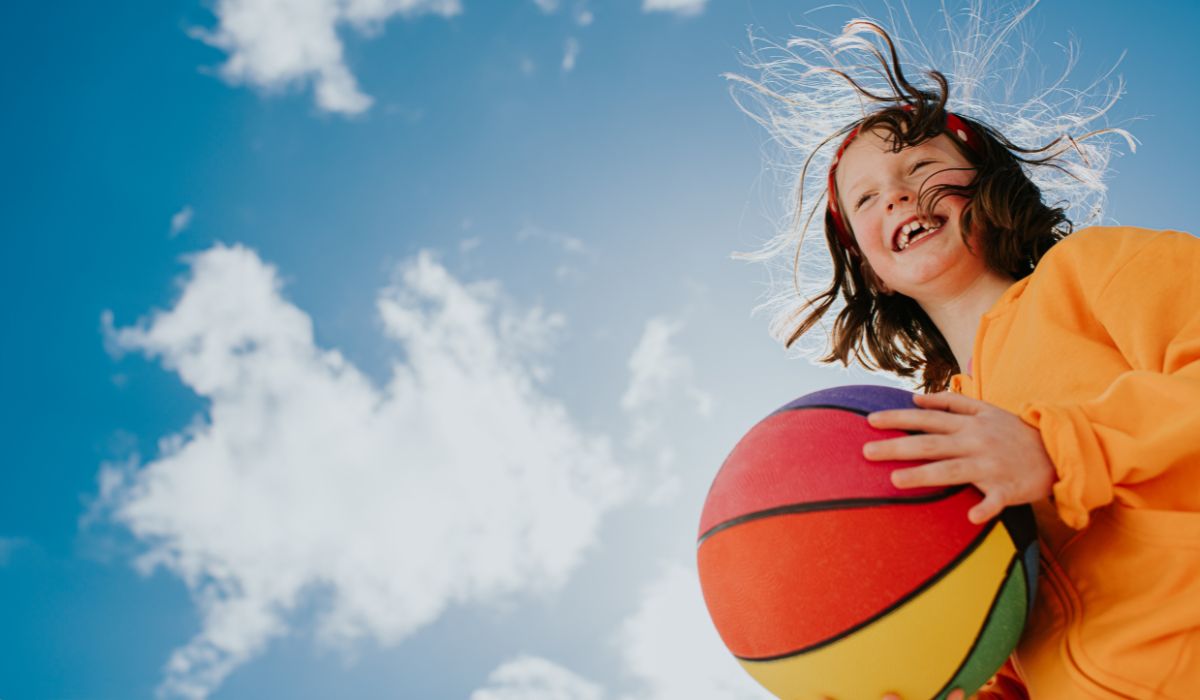 Child holding ball