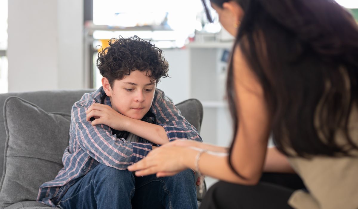 Mother talking to teenage boy