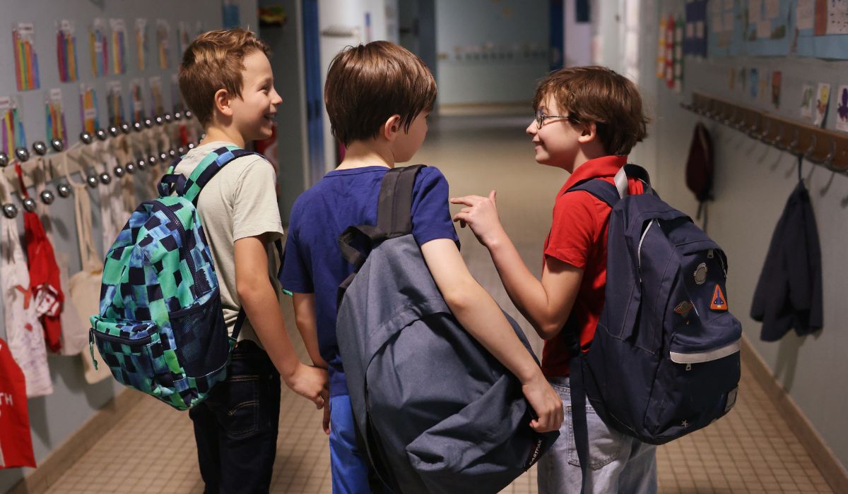 Boys talking in school learning social skills