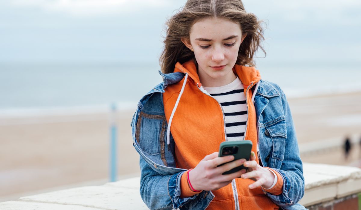 Teenage girl using phone