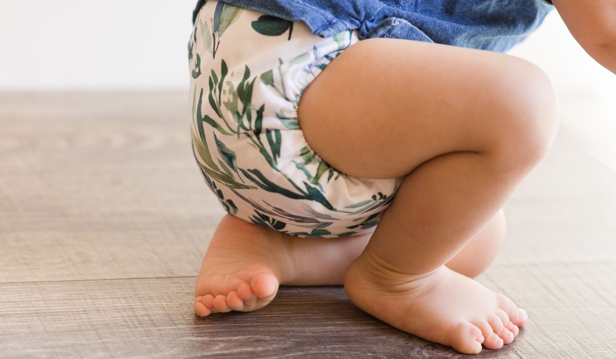 Baby wearing cloth nappy