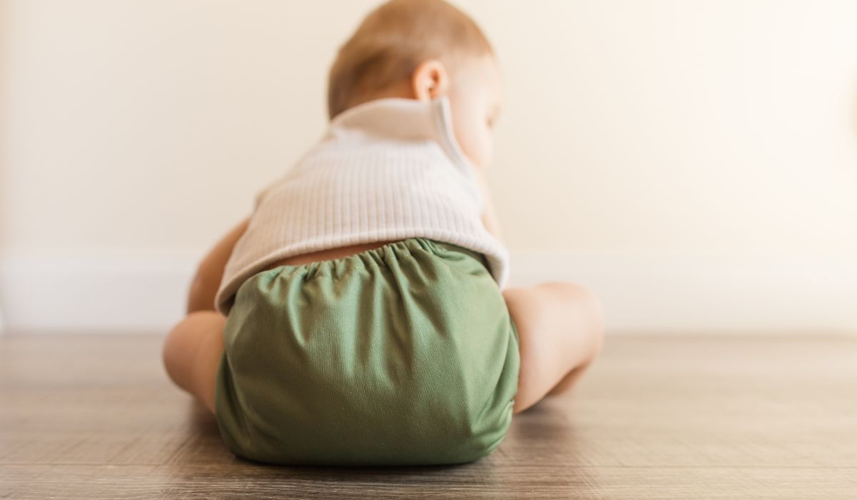 Baby wearing cloth nappy