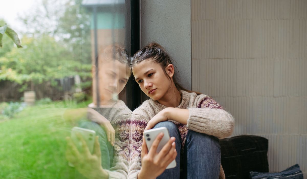 Teenager looking at phone
