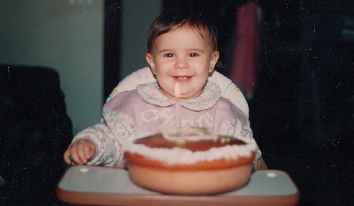 Baby girl blowing out candle