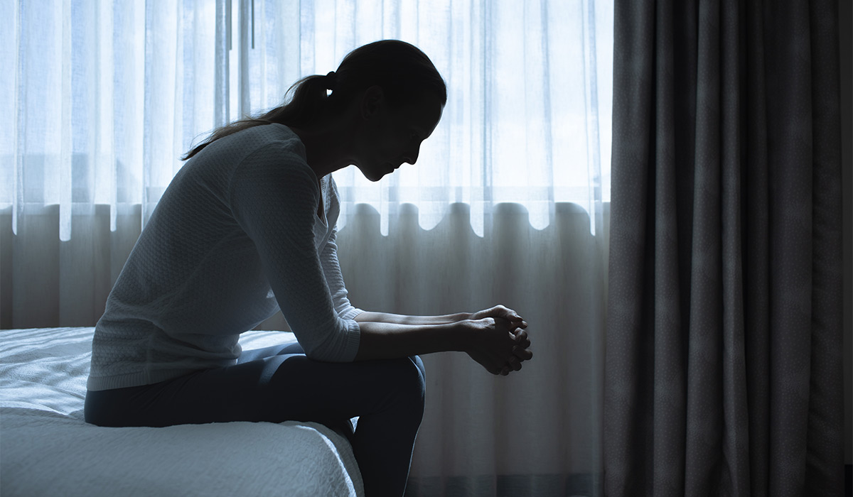 Silhouette depressed woman sadly sitting on the bed in the bedroom. Sad woman suffering depression insomnia awake and sit alone on the bed in bedroom. Depression health people concept. ; Shutterstock ID 2685850023; purchase_order: -; job: -; client: -; other: