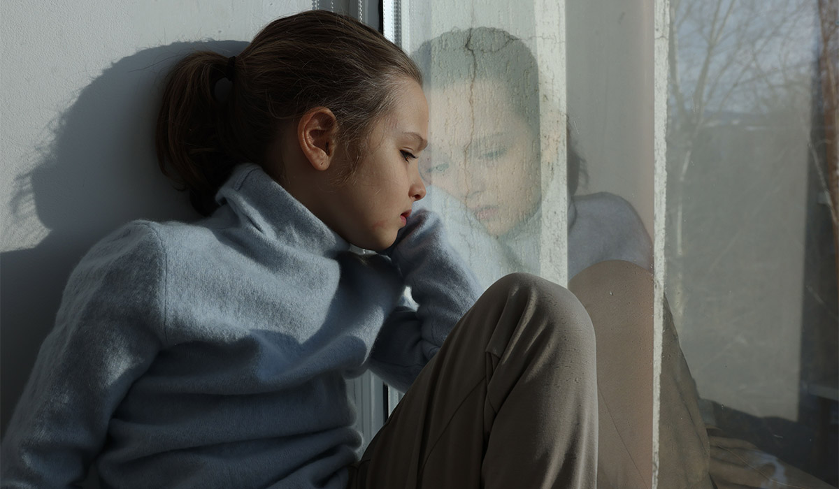 Autism. Little girl looking out window indoors; Shutterstock ID 2753834521; purchase_order: -; job: -; client: -; other: