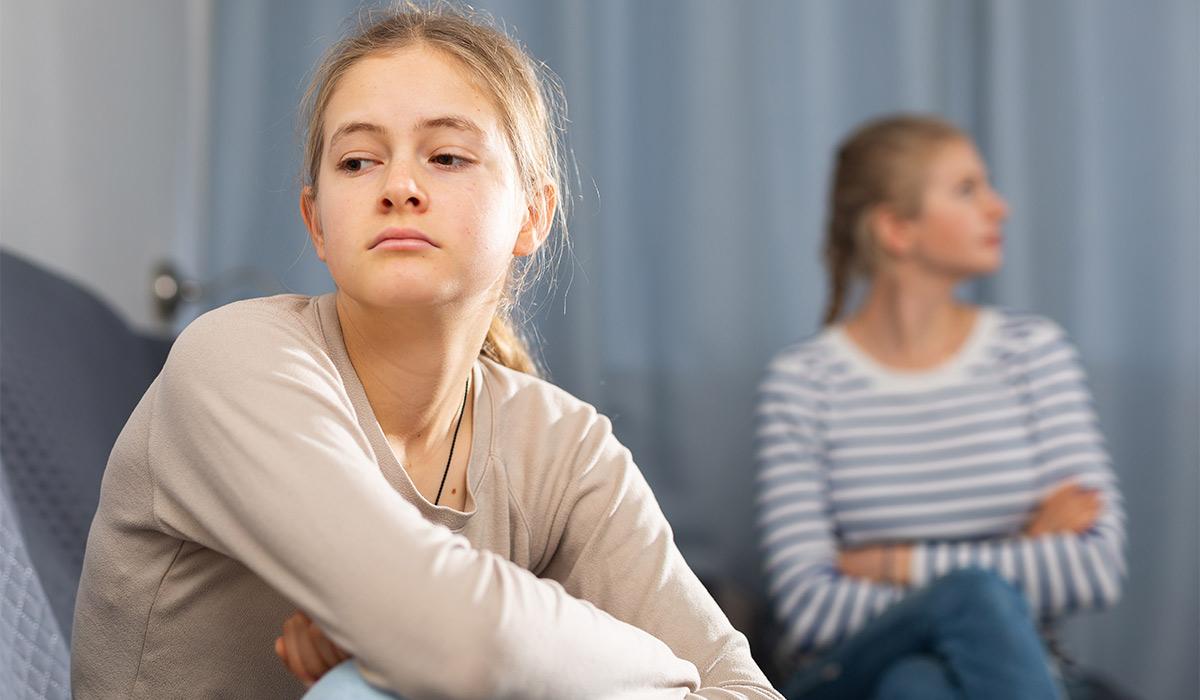 Mother soothes teen daughter after an quarrel at home; Shutterstock ID 2772500189; purchase_order: -; job: -; client: -; other: